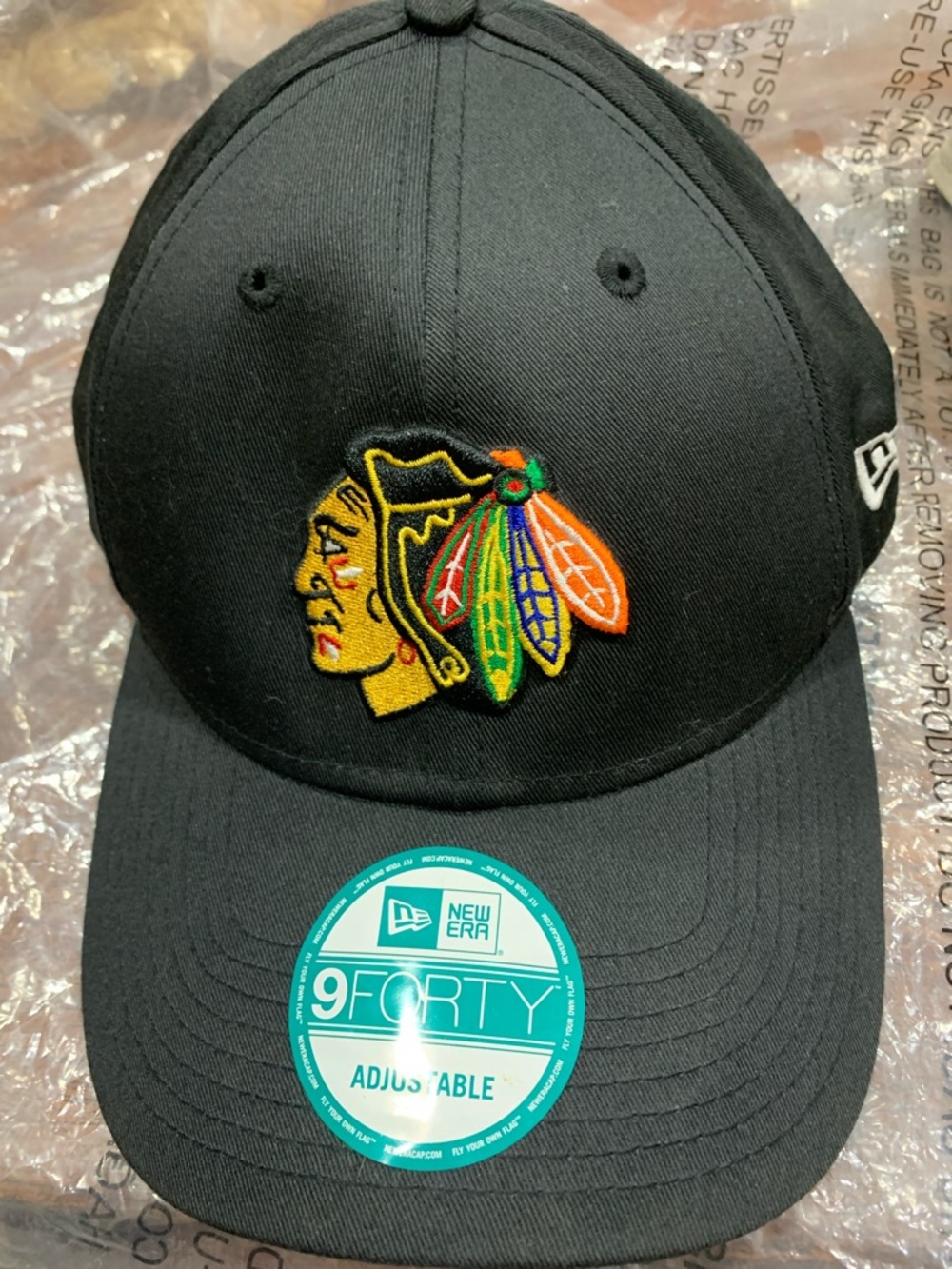 New Era Black Cap with Multicolor Feather Logo